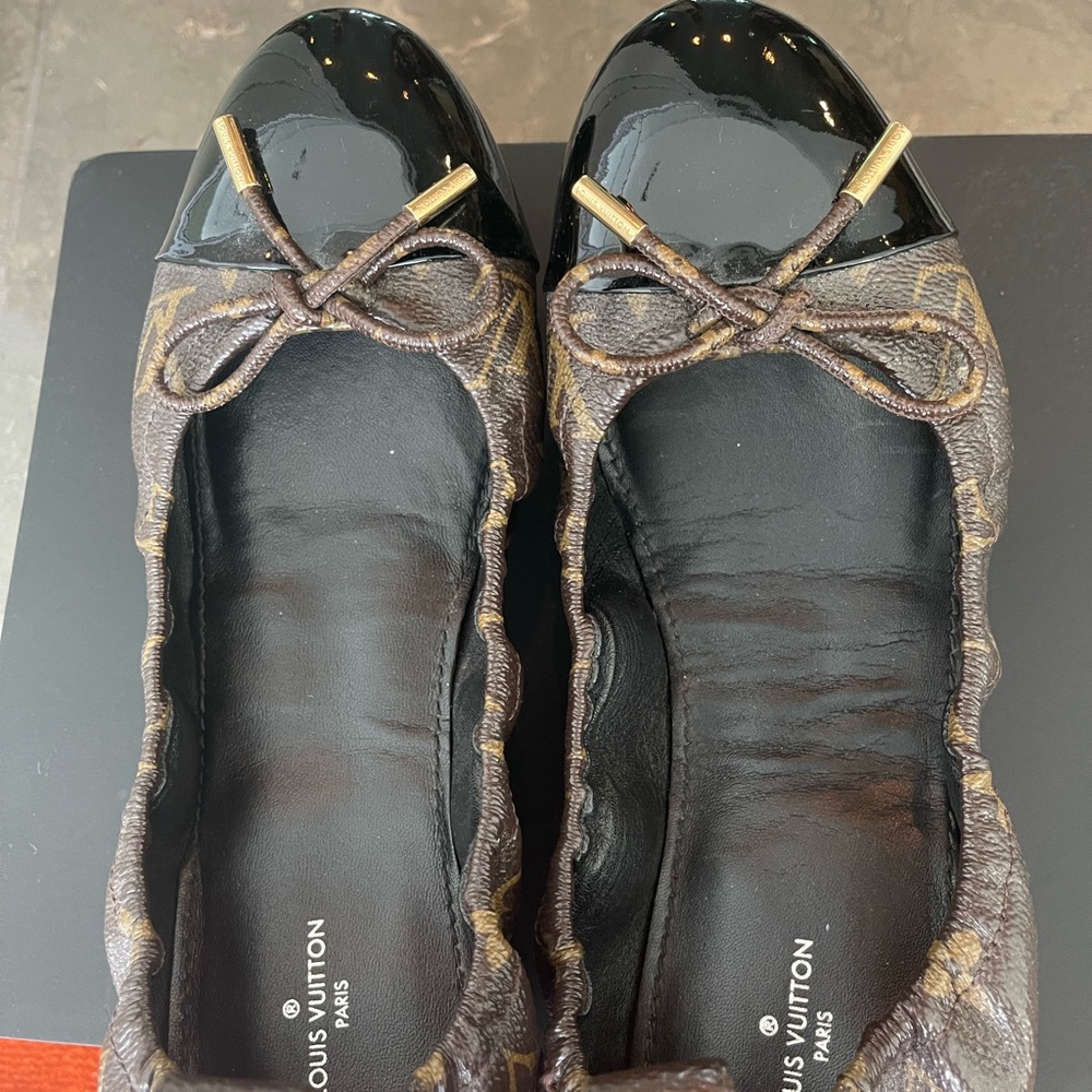 Louis Vuitton shoes. It is beautiful little too tight on me.